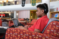 Student using laptop in campus library