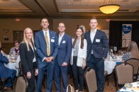 from left, Fitchburg State student Madison Pinard, Fidelity Bank Chief Lending Officer Joseph Silva, Fidelity Bank Senior Vice President Derek Beahn, and Fitchburg State students Emma Beqiri and Toivo Kramer.