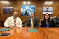 FPS Superintendent Jon Thompson, President Lapidus and FPS Assistant Superintendent Colon smile at Honors Compact signing