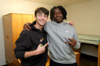 Roommates smile at camera at First Look Friday