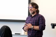 Professor Kyle Moody speaking at journalism conference