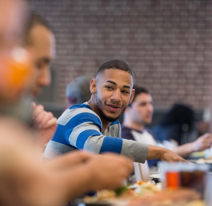 Student at Holmes Dining at dinner