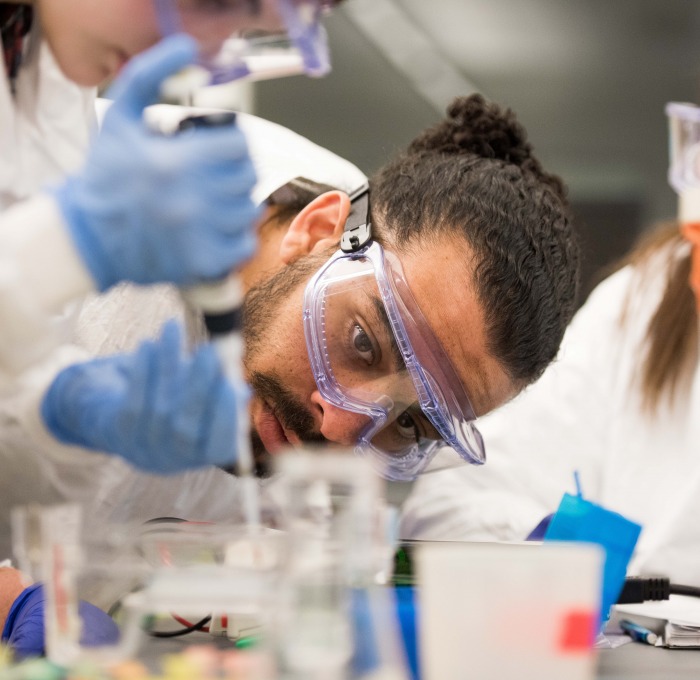 Students in lab with goggles and beakers