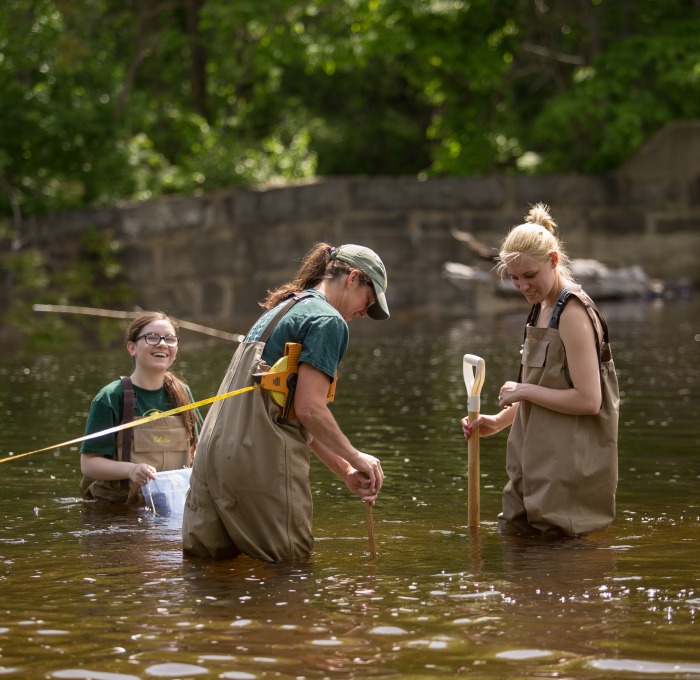 environmental bio students in river