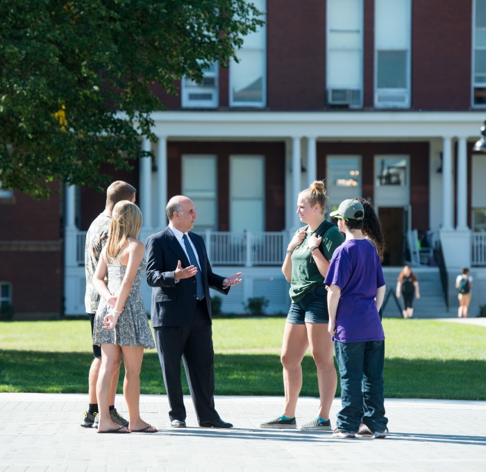 President Lapidus speaks with students on the quad