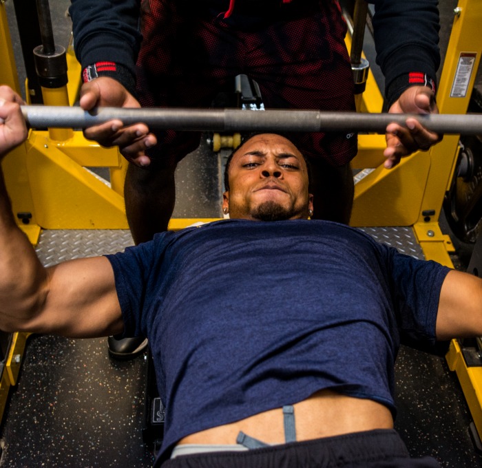 student lifting weights