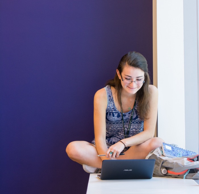 A student using her laptop to access an online course