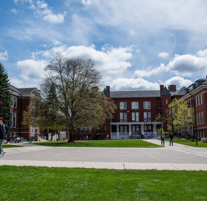 Students walking across quad on a sunny afternoon