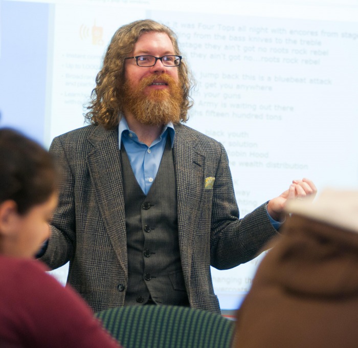 Faculty teaching in front of a classroom of students