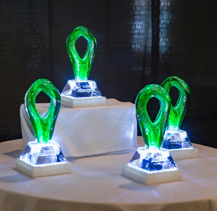 Faculty award trophies on a table
