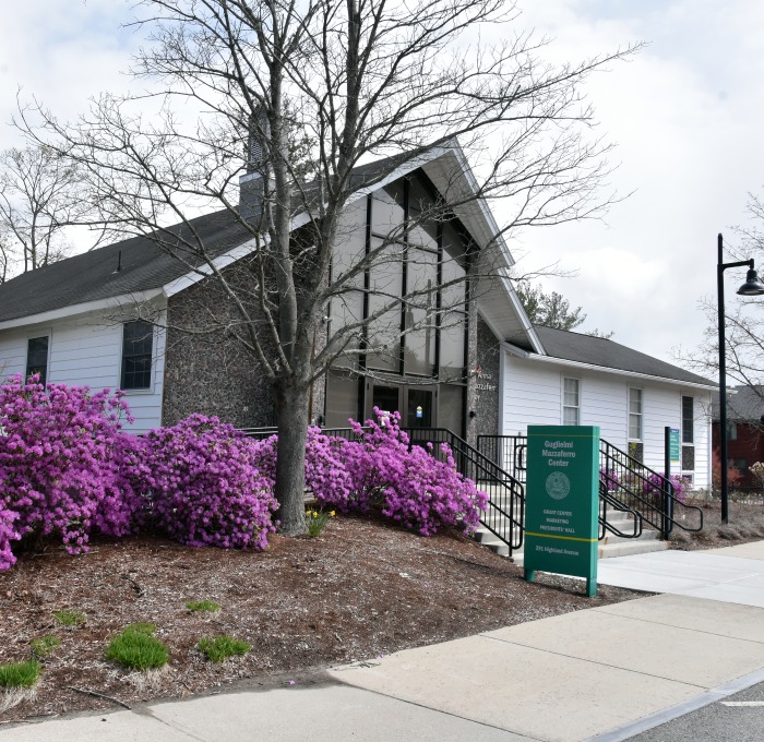 Outside of Mazzaferro building in early spring with azaleas in bloom