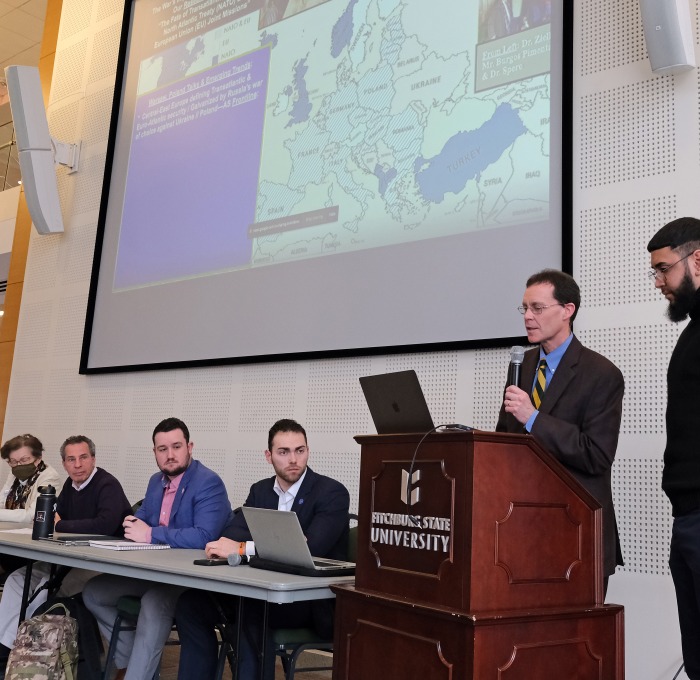 Josh Spero and panel of students and faculty at Ukranian talk in main lounge