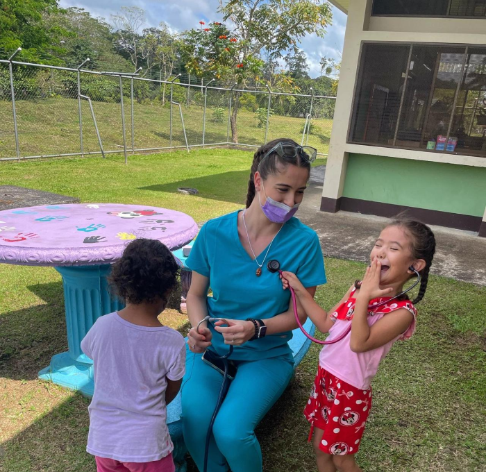 Nursing student Genevieve Casucci with children in Costa Rica