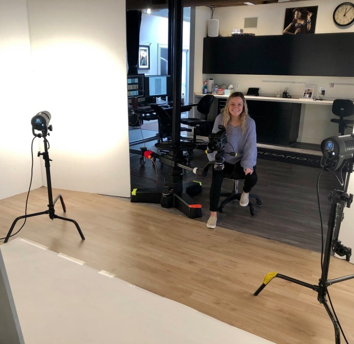 Female comm media Intern in the photography studio