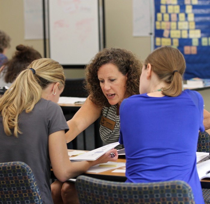 Wilson course instructor teaching female students in the classroom
