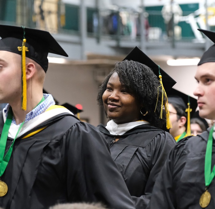 Students at end of winter commencement two male and two females