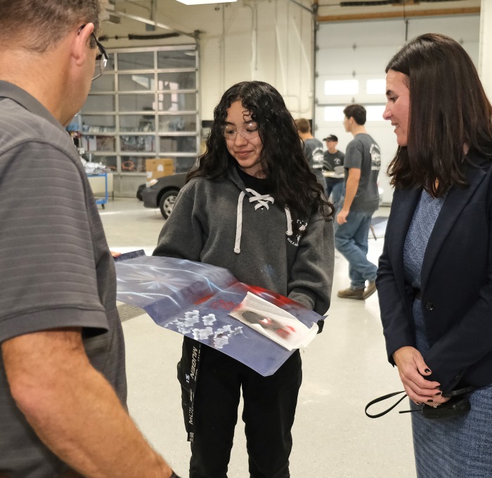 Monty Tech shop student with teacher and principal