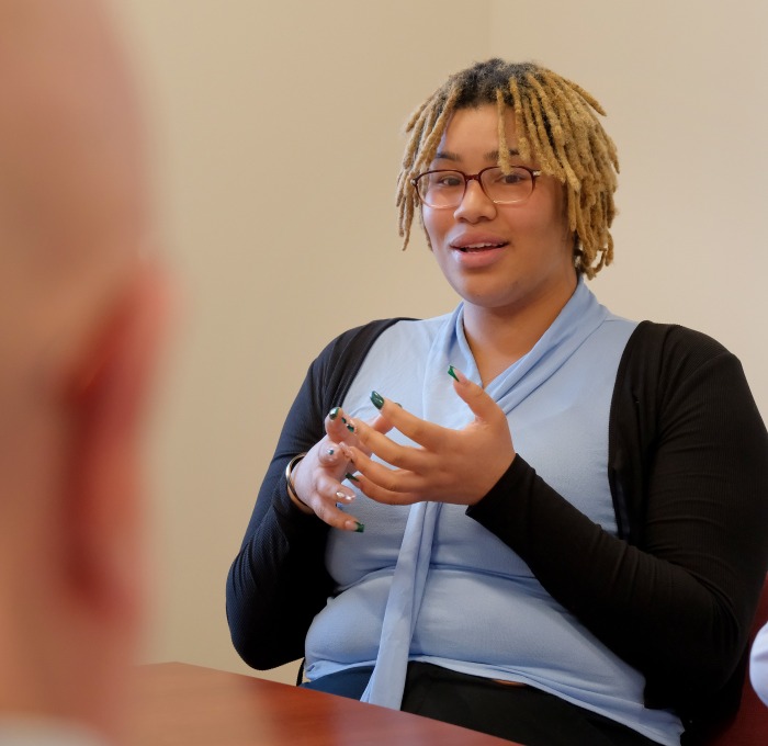 Female business student at entrepreneurship discussion