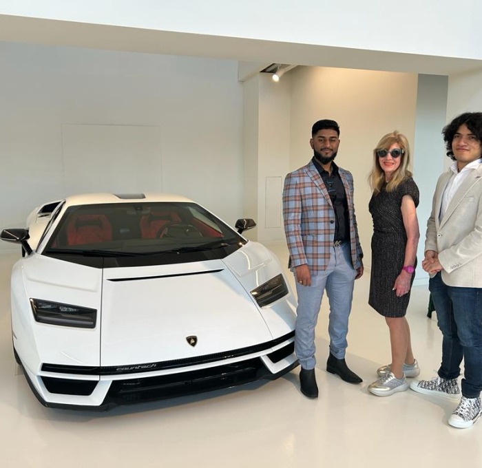 Picture of students with Lamborghini on trip to Milan, Italy