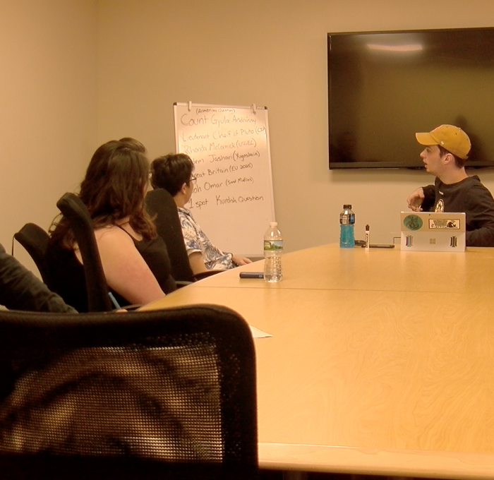 Model UN Club with Eric Budd and students in conference room