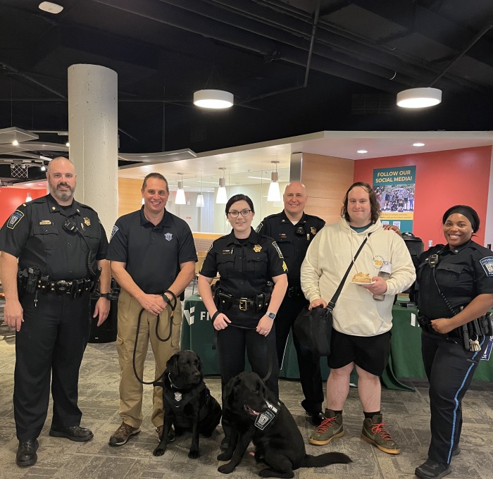 University police officers in falcon hub with police dog and students 