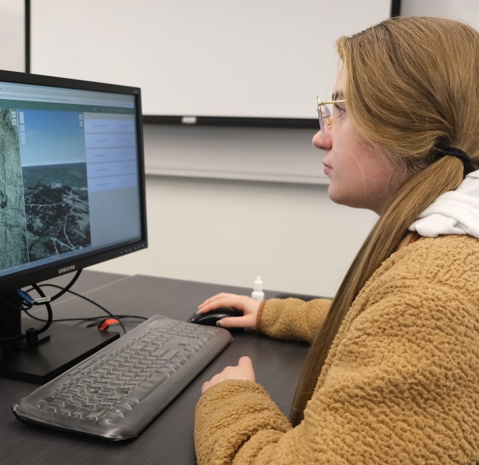 Girl on computer in a classroom