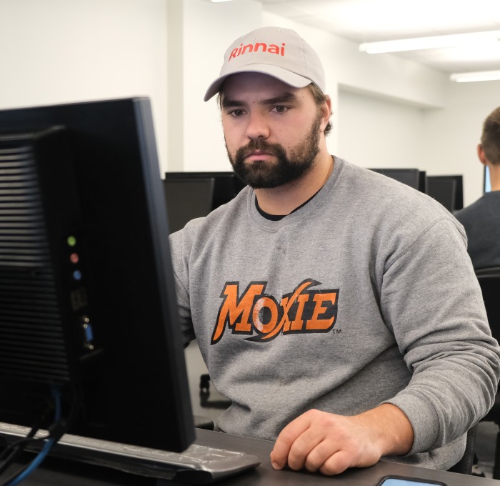 Male students in classroom at computers