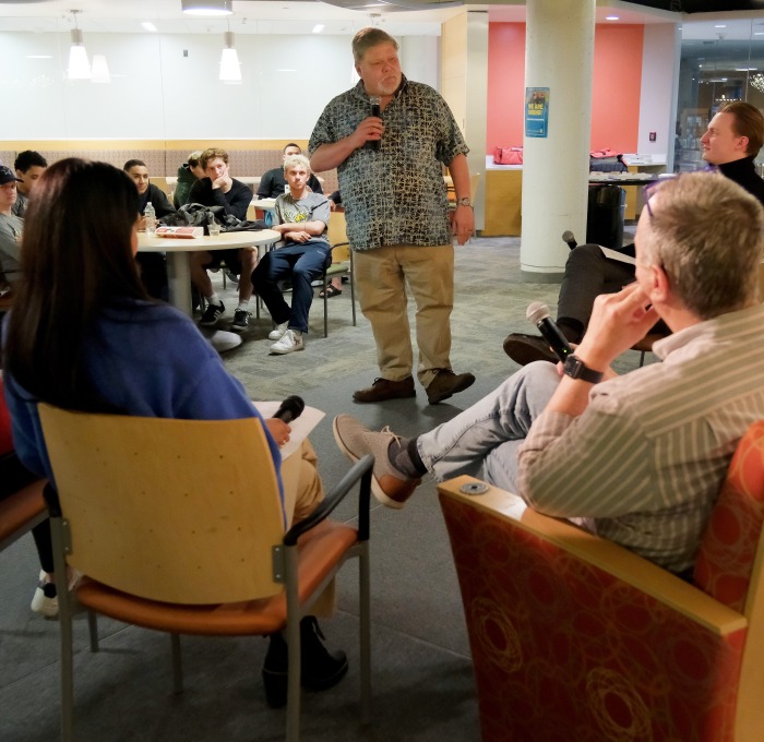 Faculty and students speaking at business honor society in Falcon Hub