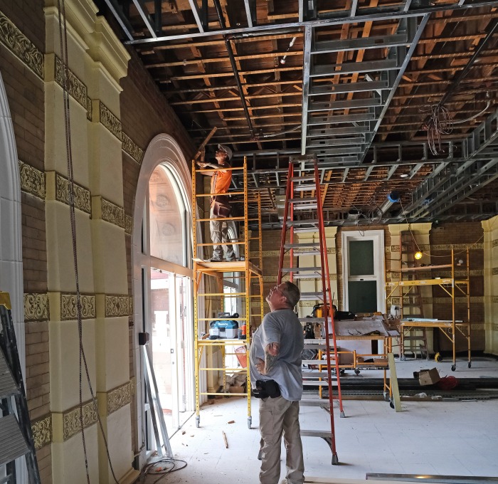 Worker and supervisor in Thompson Hall lobby