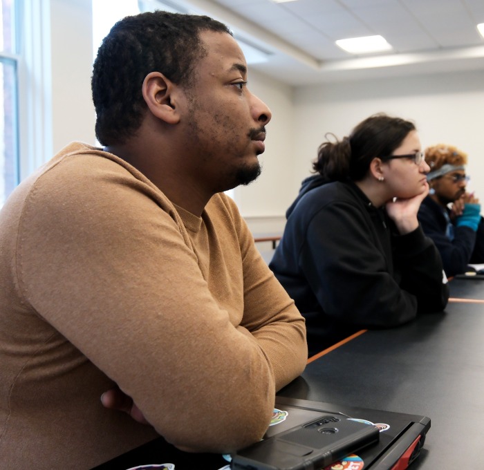 Students at table listening to Kori Ryan about internships