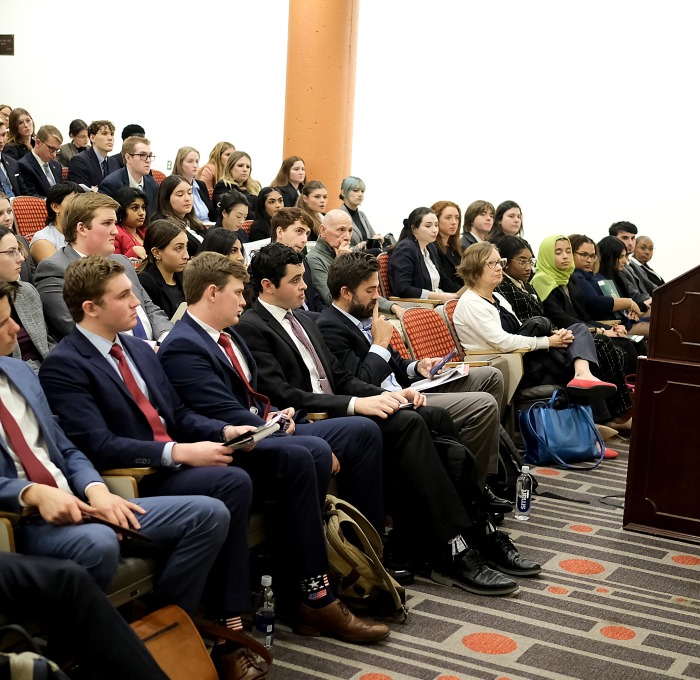 Paul Weizer at podium addressing moot court participants