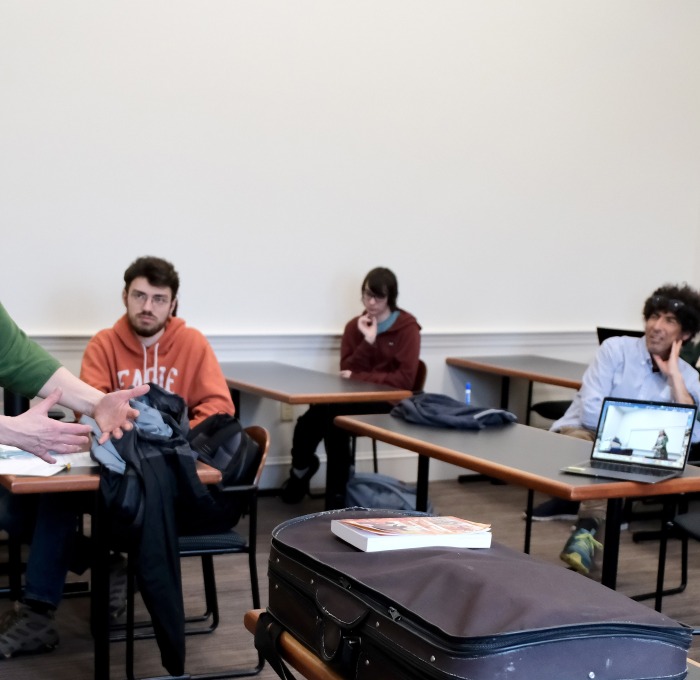 Michael Hoberman and guest lecturer in class with students