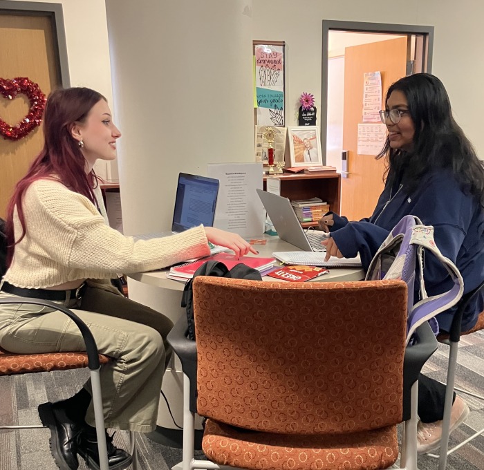 ACT student and tutor at table in office in Hammond