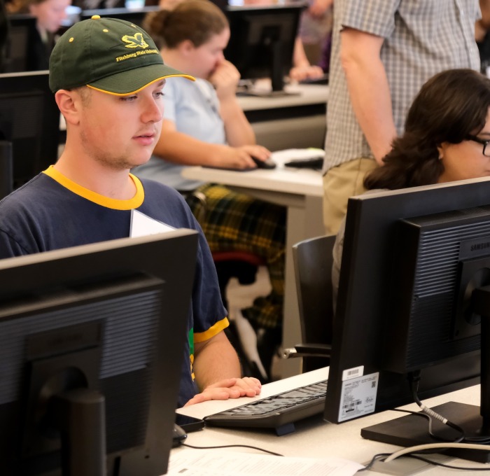 Students on computers at tables