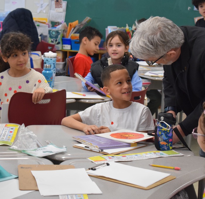Students and teacher talking in McKay classroom