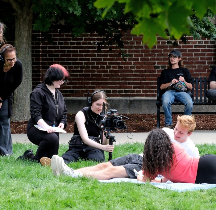 Toni Magras filming with students on the quad