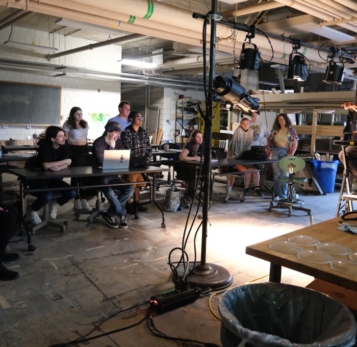 Tech theater class being instructed backstage