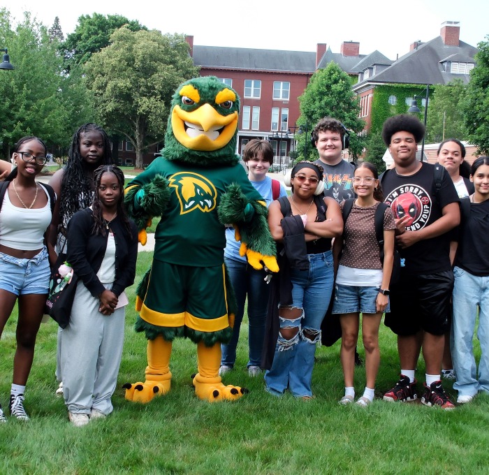 Freddy with Upward Bound students on the quad