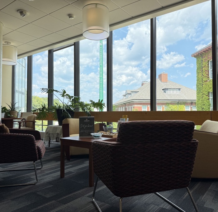 View of inside the counseling office waiting area with smokestack out the window