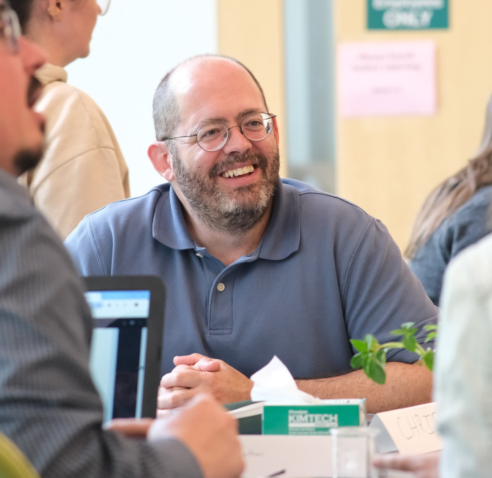 Smiling older male AP students in classroom.