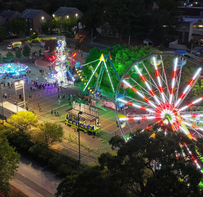 Aerial drone photo of the rides at the homecoming carnival in Ross lot on campus.