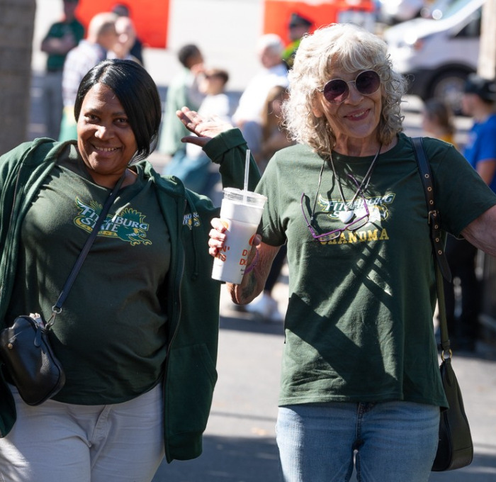 Mom and grandma at homecoming at football field.