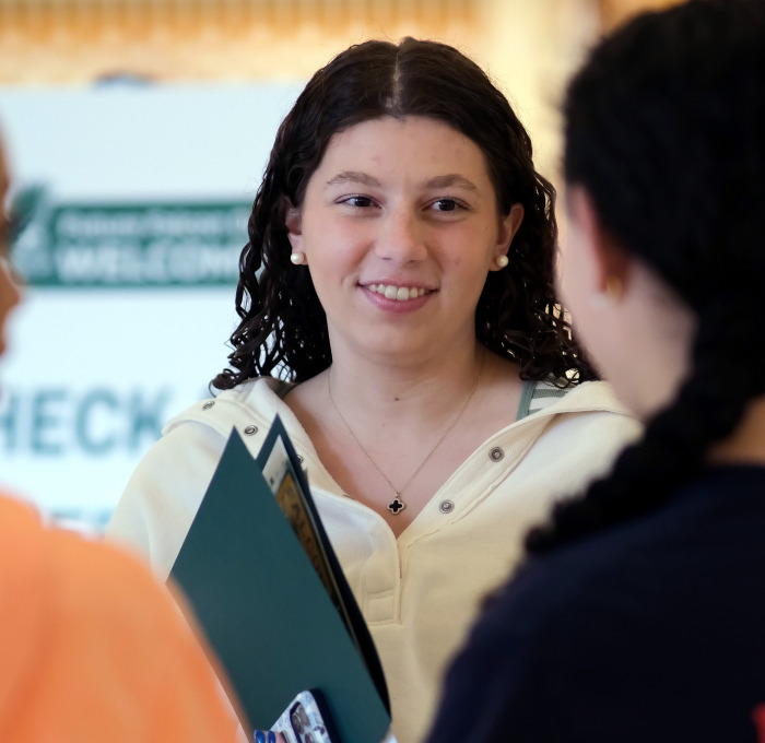 Smiling female students at future falcon day.