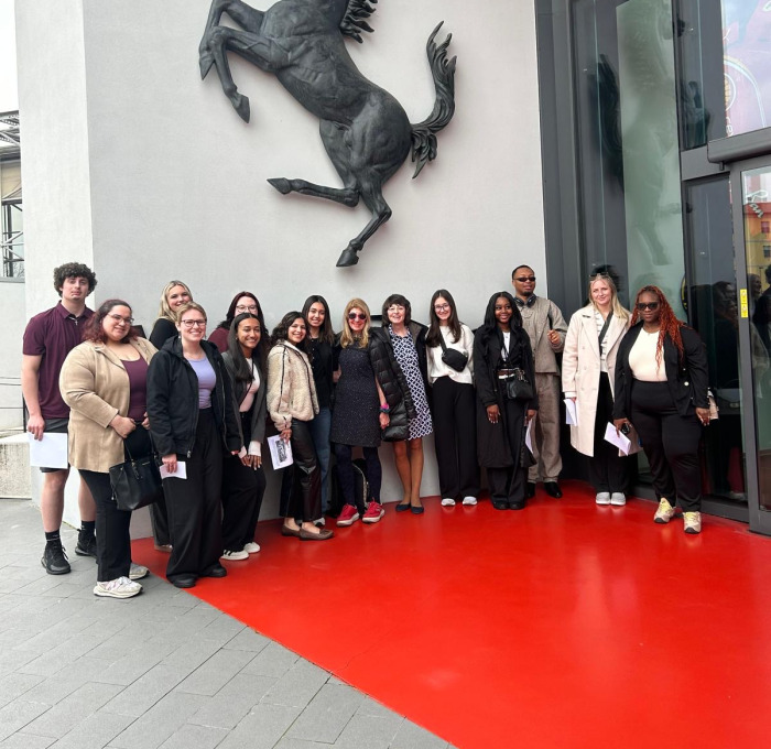 Milan luxury brand group trip at Ferrari factory.