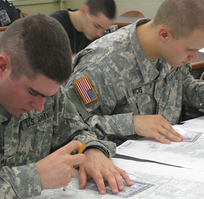 ROTC students working with maps