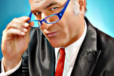 Jimmy Mazz pointing with glasses. 