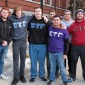 Conlon Hickey and Sigma Tau Gamma brothers in front of Edgerly Hall