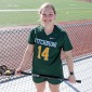 Julia Miele '22 with lacrosse stick at Elliot Field
