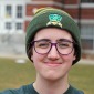 Laurie Furtado '22 on quad in quiddich hat 