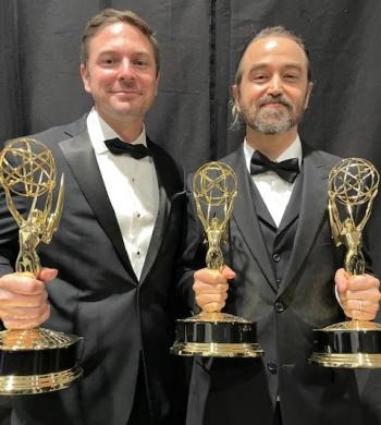 Emmy winning alumnus Gregg Swiatlowski, left, with his award